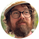 Niall Deehan, bearded man with glasses and hat